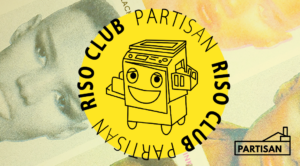 A yellow round badge featuring black line art illustration of a RISO duplicator. Around the edges of the badge reads in black type Partisan RISO Club. In the background of the badge is a cropped image of Grace Jones RISO printed portrait. There's the Partisan logo in the bottom right corner.